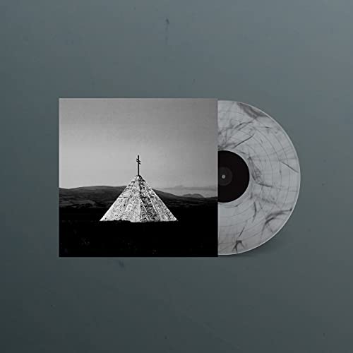 Vinyl record and album cover featuring a small, dark church in a landscape.
