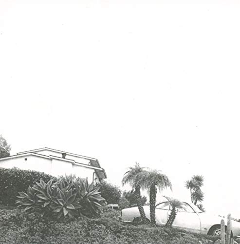 Black and white album cover with a house, palms, and a car.