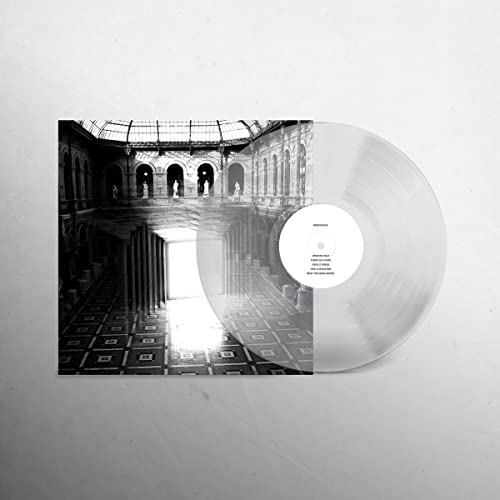 Clear vinyl record with black and white architectural album cover art.