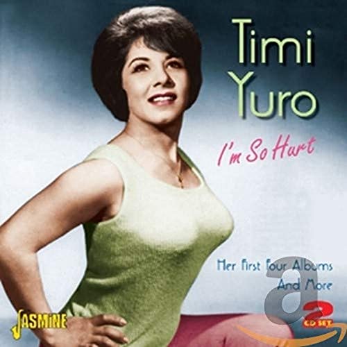 Timi Yuro wearing a light green top on the cover of her CD collection.