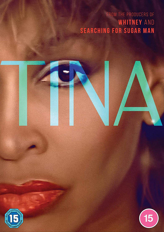 Close-up portrait of Tina Turner with the word TINA overlaid in large blue letters.