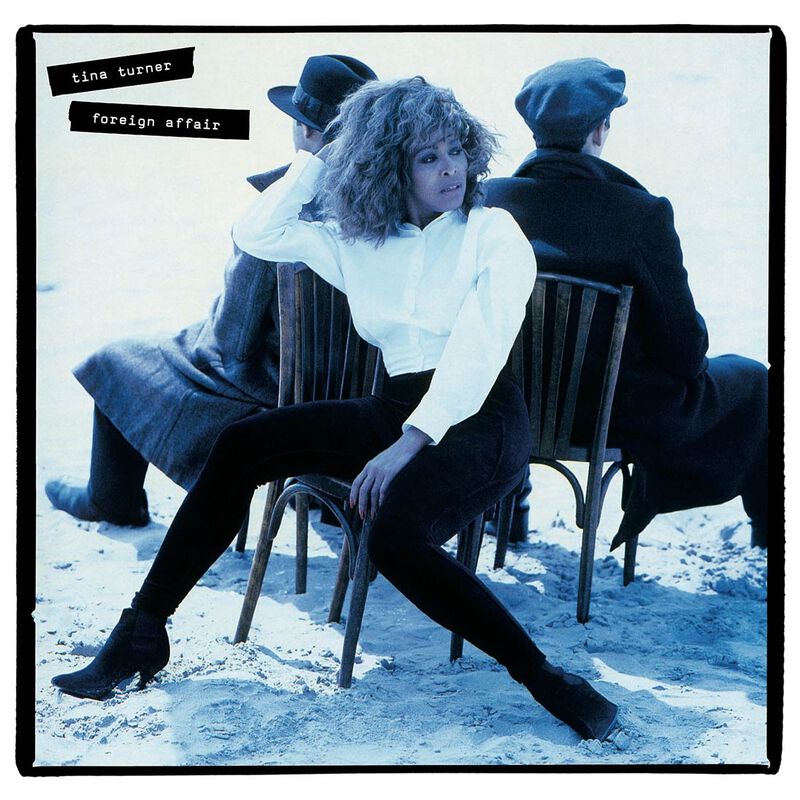 Tina Turner album cover, "Foreign Affair," featuring a seated portrait in blue tones.