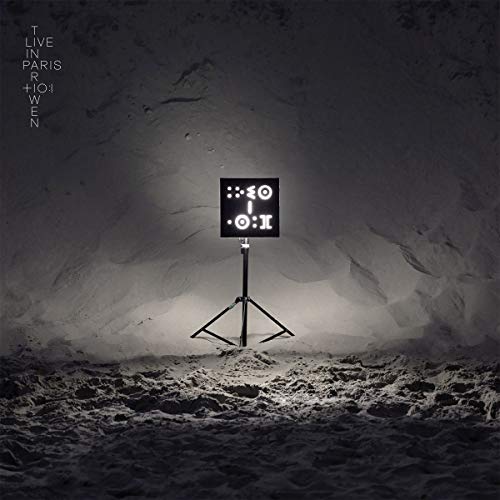 Tinariwen "Live in Paris" CD cover: spotlight on a microphone stand.