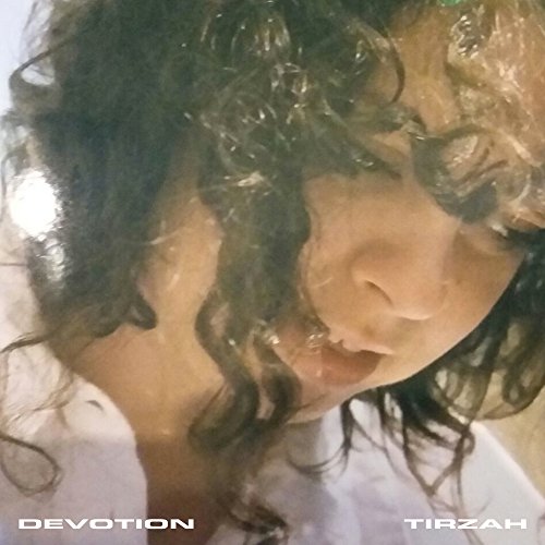 CD cover for Tirzah’s “Devotion,” featuring a close-up portrait with curly hair.