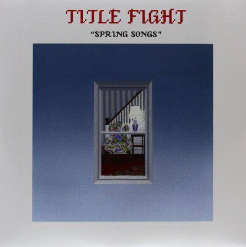 "Album cover with a window showing a room with a staircase."