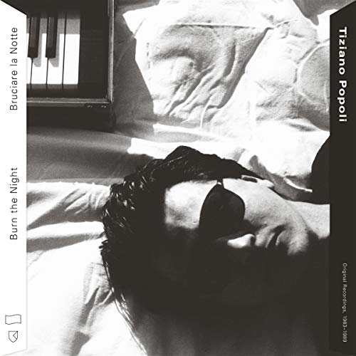 Vinyl album cover: a person lies on a rumpled white bed, black and white.