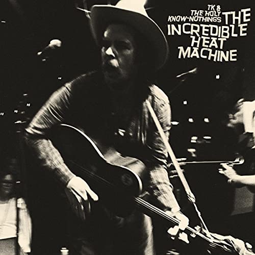 Black and white album cover featuring a musician playing guitar.