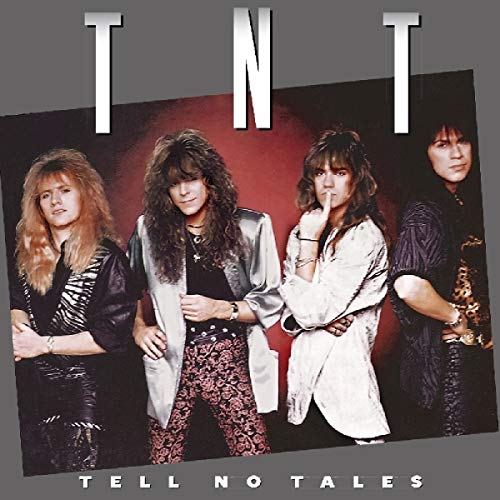 Album cover with four men standing in front of a red background.