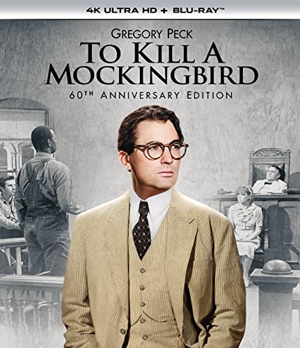 Gregory Peck in a suit and glasses on the To Kill a Mockingbird movie cover.