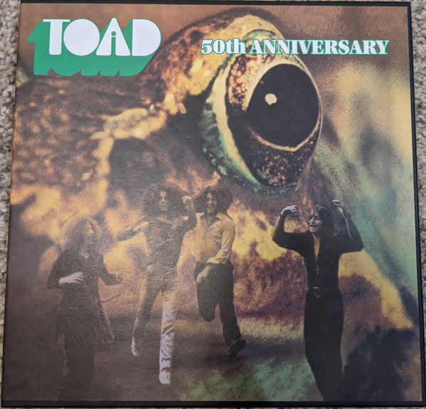 Toad album cover: giant eye looms over people running in a field.