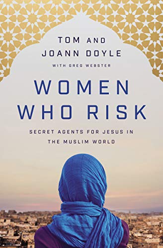 Book cover featuring a woman in a blue hijab overlooking a city at sunset.