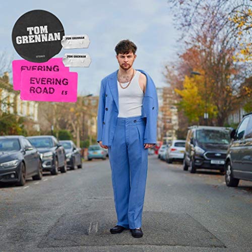 Tom Grennan album cover featuring artist in blue suit on a street.