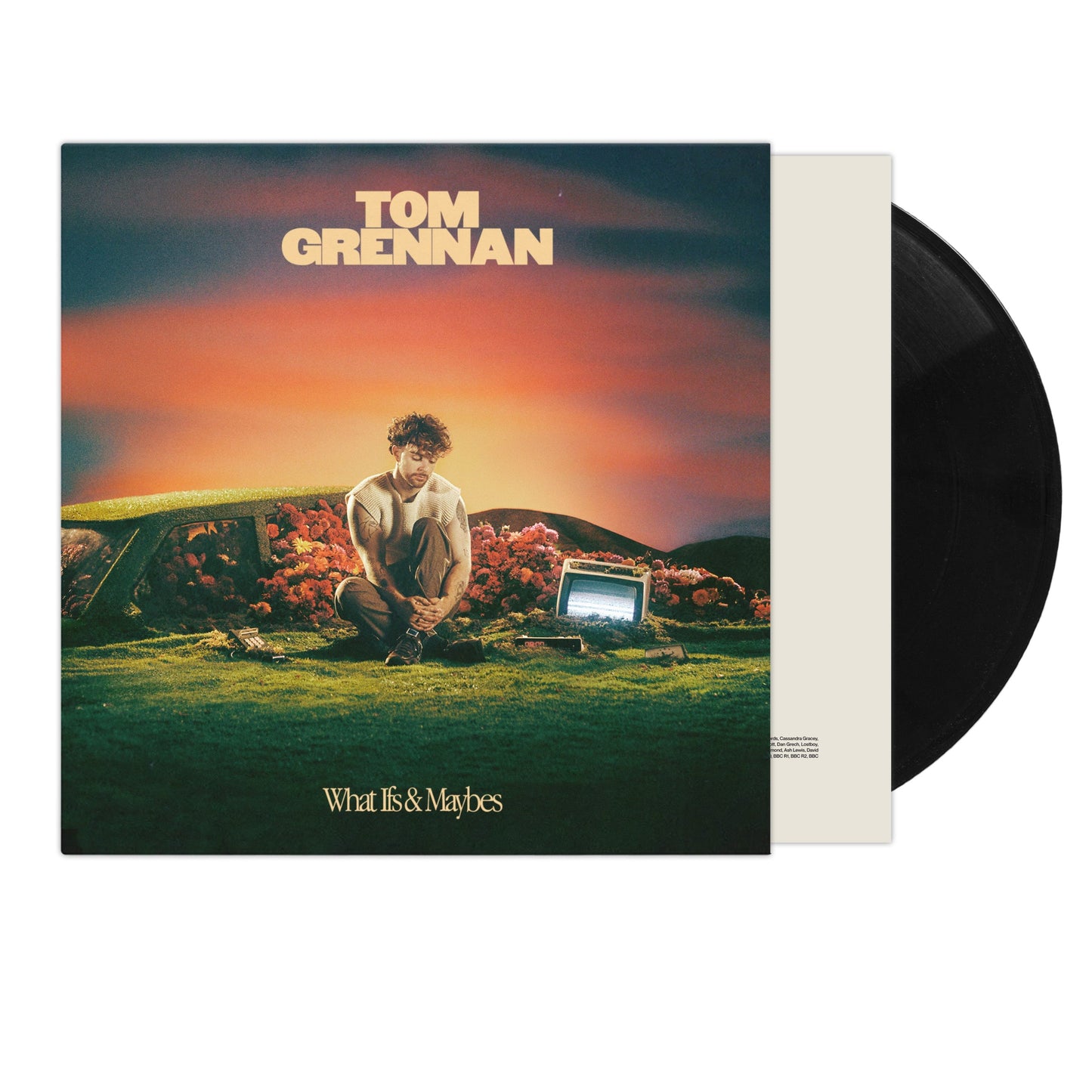 Tom Grennan album cover and two black vinyl records shown.