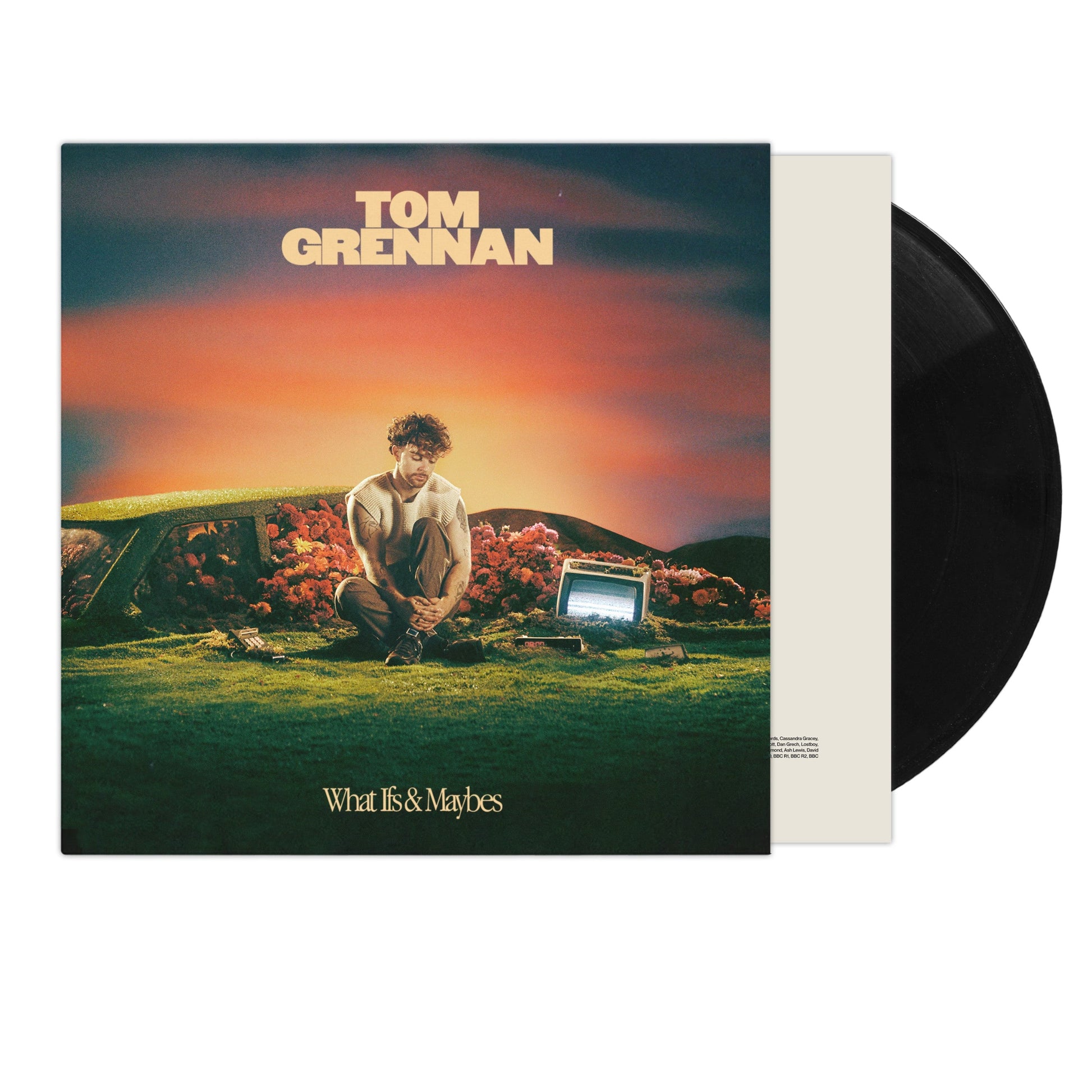 Tom Grennan album cover and two black vinyl records shown.