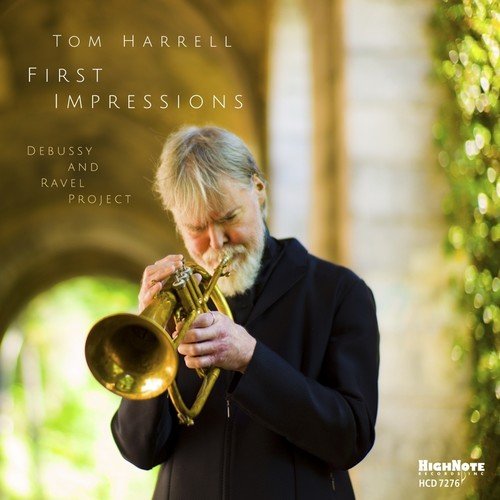 "Album cover featuring a man playing a trumpet, outdoors, with text."