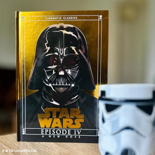 Gold-edged book cover featuring Darth Vader and a Stormtrooper figurine.