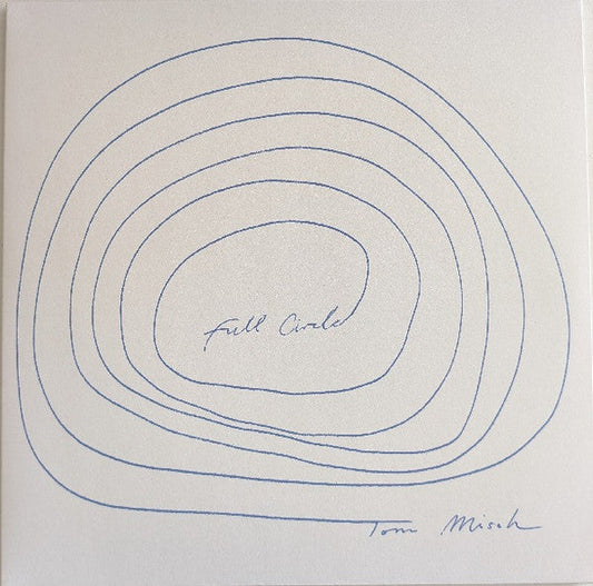 Vinyl record cover with blue concentric circles and handwritten text.