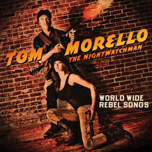 Man and woman posing with guitar against a brick wall, text overlay.