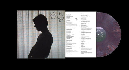Tom Odell's "Black Friday" vinyl record with silhouette cover and colorful disc.