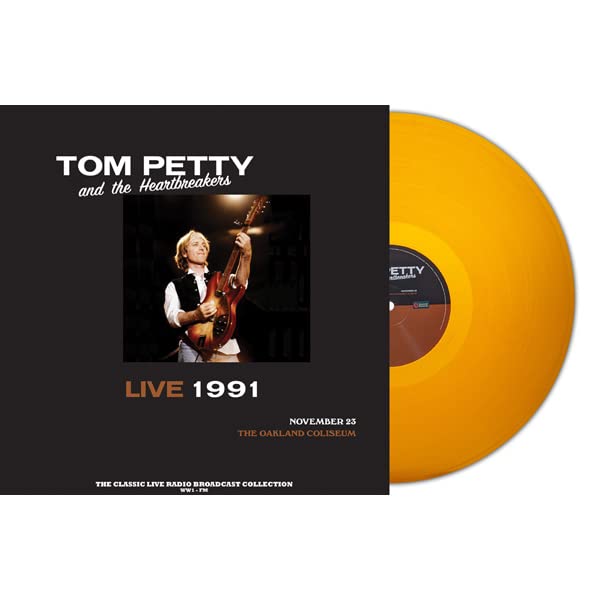 Tom Petty album cover and orange vinyl record, live concert recording.