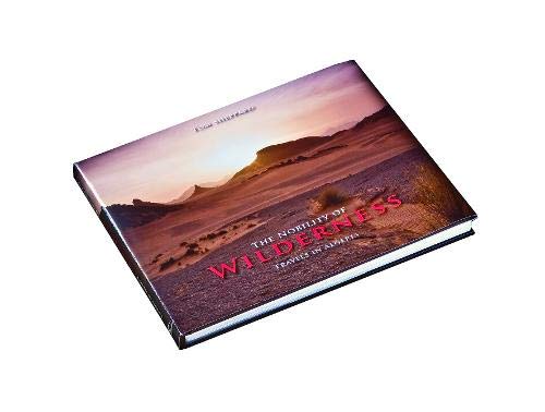 Book cover featuring a desert landscape with red sand dunes under a pale sky.