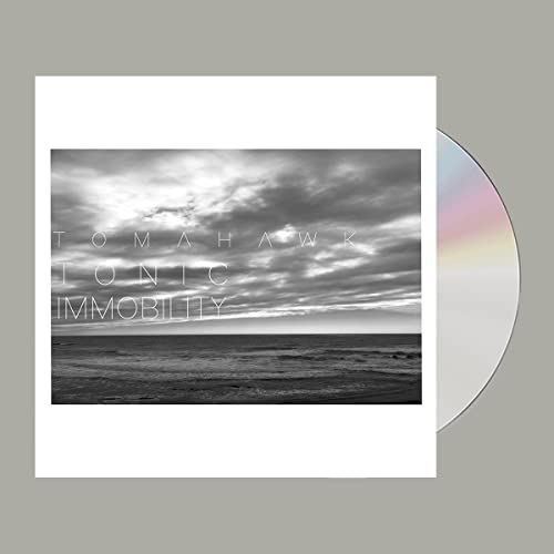 CD cover featuring a black and white ocean scene under a cloudy sky.