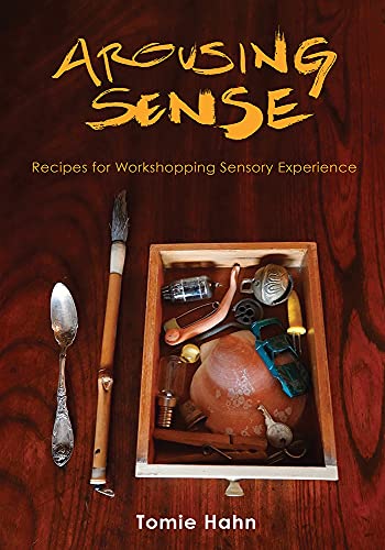 Book cover: "Arousing Sense" with a wooden box of curious objects.