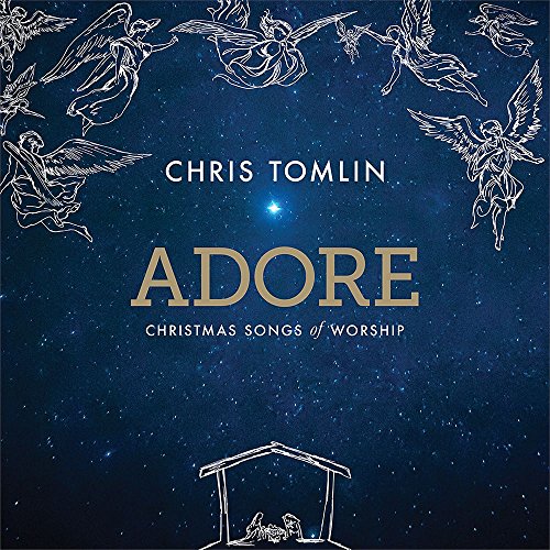 "Chris Tomlin's 'Adore' album cover featuring angels, a manger scene, and a starry night sky."
