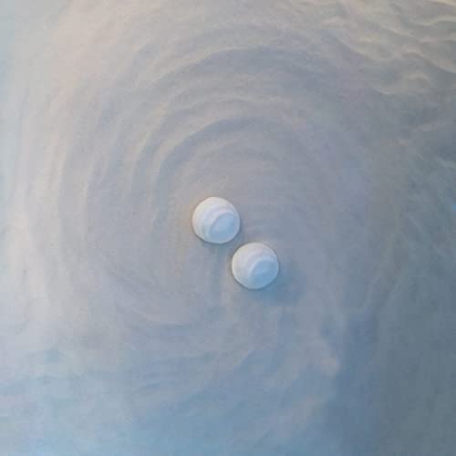 CD case with two white knobs on a swirling, textured surface.