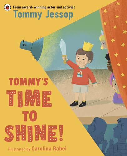 Boy with a crown holds a sword under a spotlight on stage.