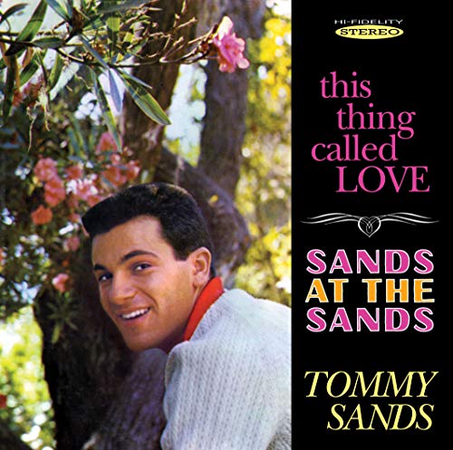 Tommy Sands album cover featuring a man in a tree with pink flowers.