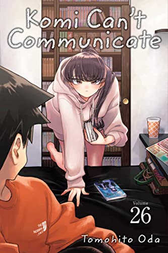 Manga cover showing Komi leaning over a bed toward a boy in a room.