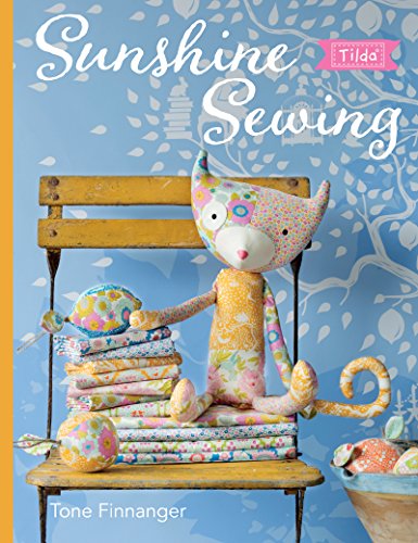 Book cover featuring a fabric cat and floral patterned textiles.