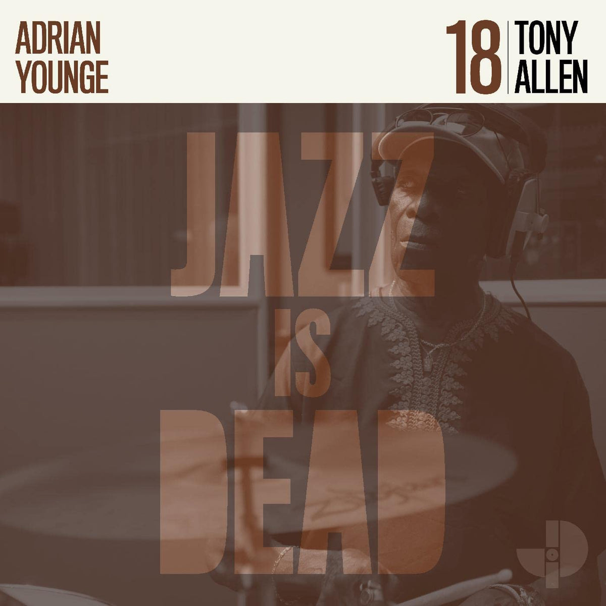 "Album cover with a man playing drums and 'JAZE IS DEAD' text overlay."