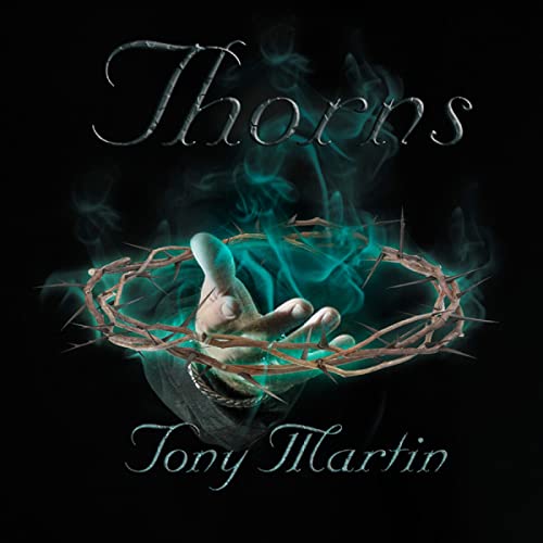 AlbumBoutique album cover showing a hand holding a crown of thorns with teal smoke.