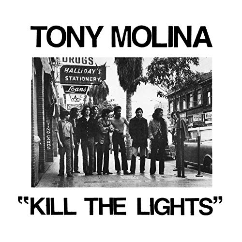 Black and white vinyl album cover with a group of men on a sidewalk.