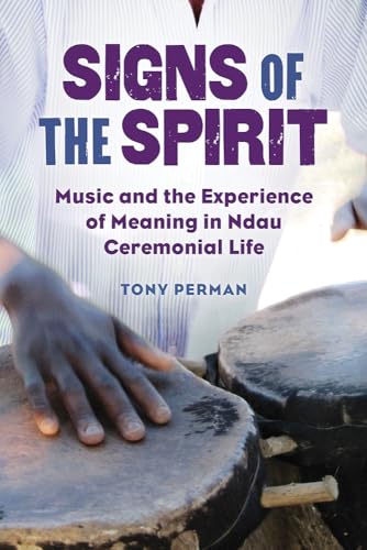 Book cover with title “Signs of the Spirit” and drums in foreground.