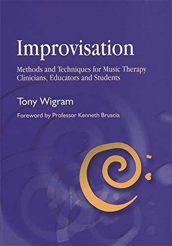 Book cover: "Improvisation" by Tony Wigram, with a gold spiral design.