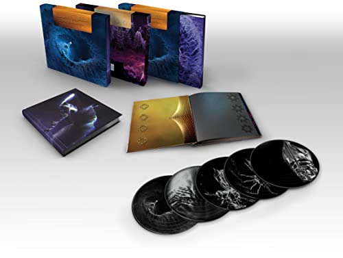"Image shows a vinyl record set with a box, booklet, and four black vinyl records."