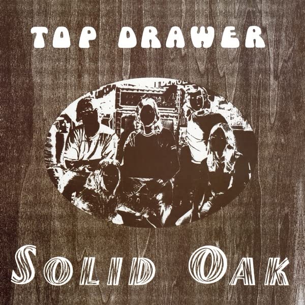 CD cover: "Top Drawer - Solid Oak" with a band photo in an oval.