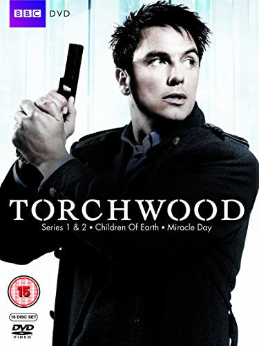 "Torchwood DVD cover featuring a man holding a gun, with title text."