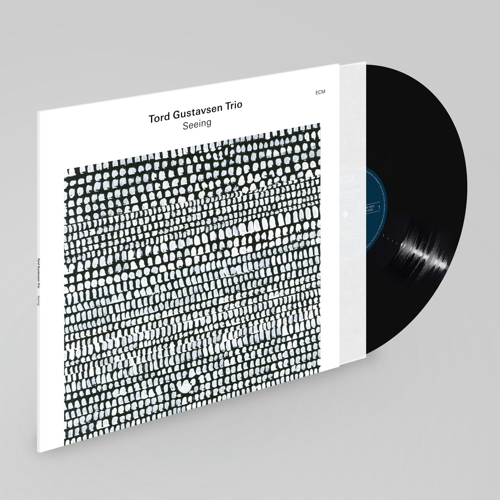 Vinyl record of Tord Gustavsen Trio’s “Seeing” with abstract black and white cover.