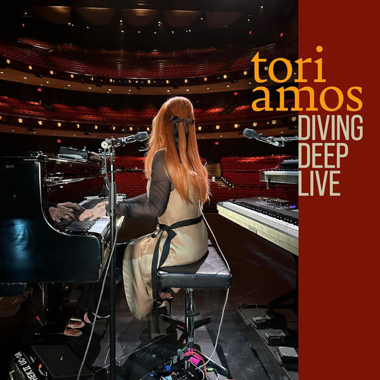 Tori Amos at a piano on stage, album cover for "Diving Deep Live.