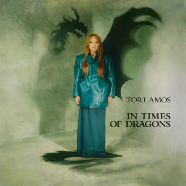 Tori Amos album cover featuring a woman and a shadowy dragon.