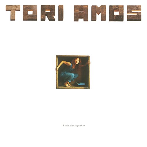 "Tori Amos album cover featuring a woman in a wooden picture frame on white background."