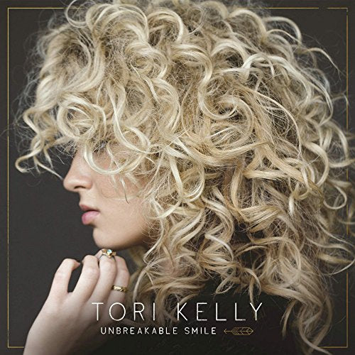 Tori Kelly album cover, close-up of woman with curly blonde hair.
