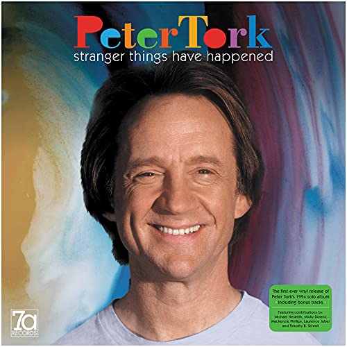 Album cover featuring Peter Tork against a colorful abstract background with text overlays.