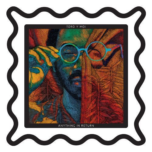 "Toro Y Moi vinyl record cover with a man's face and wavy black border."