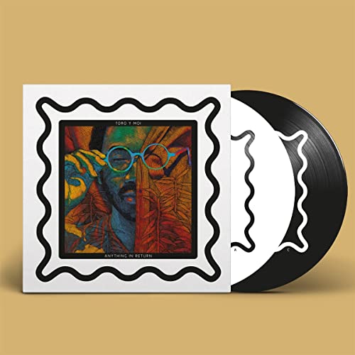 Vinyl record and cover with colorful album art and wavy black border.