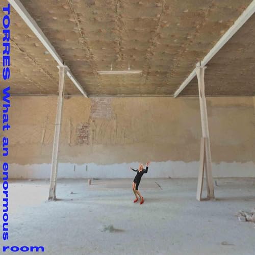 Album cover for Torres’ “What An Enormous Room” featuring a lone figure.